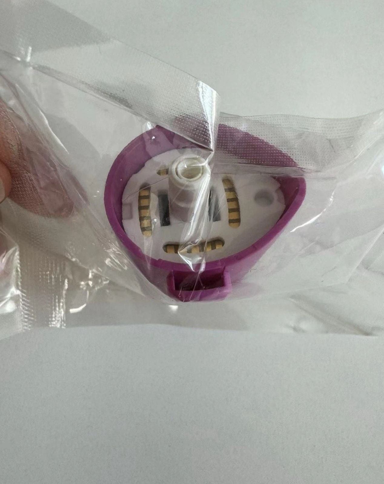 Close-up of SOLTA Thermage FLX Total Tip 4.0cm² cartridge in sealed packaging, highlighting internal gold contact points for aesthetic device connection.
