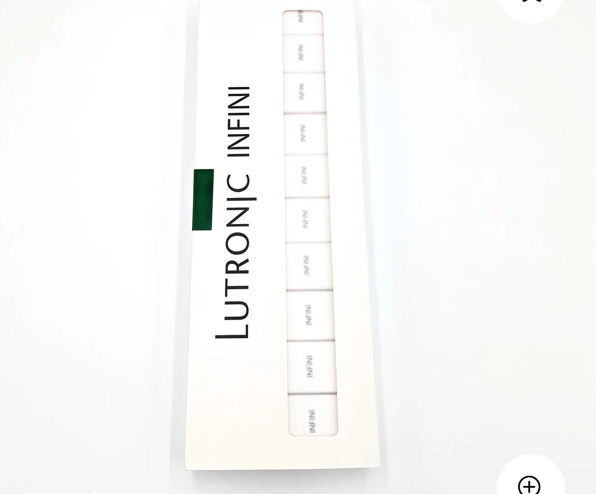 Open box of Lutronic Infini 49-pin microneedling tips showing individually packed cartridges, designed for RF skin treatment systems.